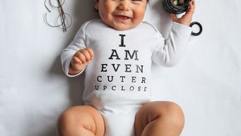Adorable baby in pun-filled onesies