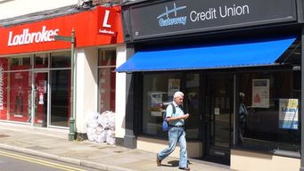 Why are credit unions in the UK not very popular