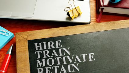 How can businesses retain and attract staff in an increasingly competitive labour market?