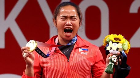 With a flick of the wrist, Hidilyn Diaz lifts the spirit of a struggling nation...