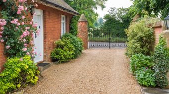 How do you capture the development value of land received by charities as gifts in wills?