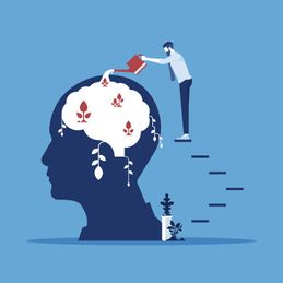 Businessman watering that growing plant from the brain as metaphor growth personality, personal growth, thinking positive