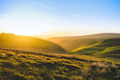 Beautiful landscape view of green fields and meadows at sunset in Snowdonia, Wales. The beauty of nature
