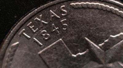 テキサス州記念25セント硬貨 アメリカ合衆国 選挙 民主主義 愛国心 .USA 州名 通貨 経済 硬貨 マクロ写真。歴史的出来事と政治の価値