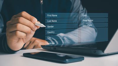 Filling your information. Register your personal data details information, Business people fill online application form with name, email, address, phone number and date of birth for registration.