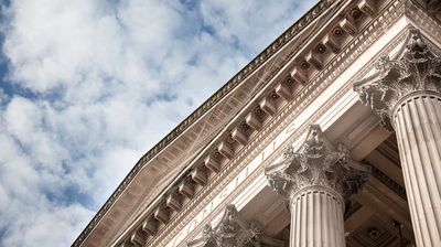 Columns building with cloudy blue skySandstone columns on crown court building