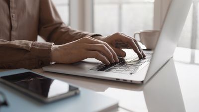 Young man working on laptop computer. Work from home, manager, internet marketing, freelance, student lifestyle, entrepreneur, business, employee concept