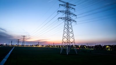 High voltage electricity tower landscape at sunset