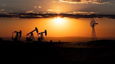 Landscape with silhouette of oil pumps. Western landscape in the United States., like Texas with dramataic sky during sunset Oil and gas industry, drilling and oil production. concept. 3D illustration
