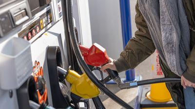 A person filling up gasoline
