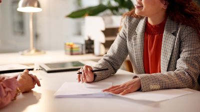 Contract, woman and hands of advisor for interview, information or document for job application. Advice, client or human resource agent with paperwork for registration, opportunity or deal agreement