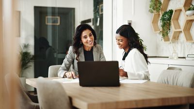 Meeting, women and business people with laptop in office, investment project and discussion. Teamwork, accountant and financial advisor with feedback for finance update, report review and documents