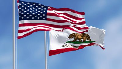 California state flags and the American flags waving in the wind, featuring a brown bear and the words California Republic. 3d illustration render. Fluttering fabric. Selective focus