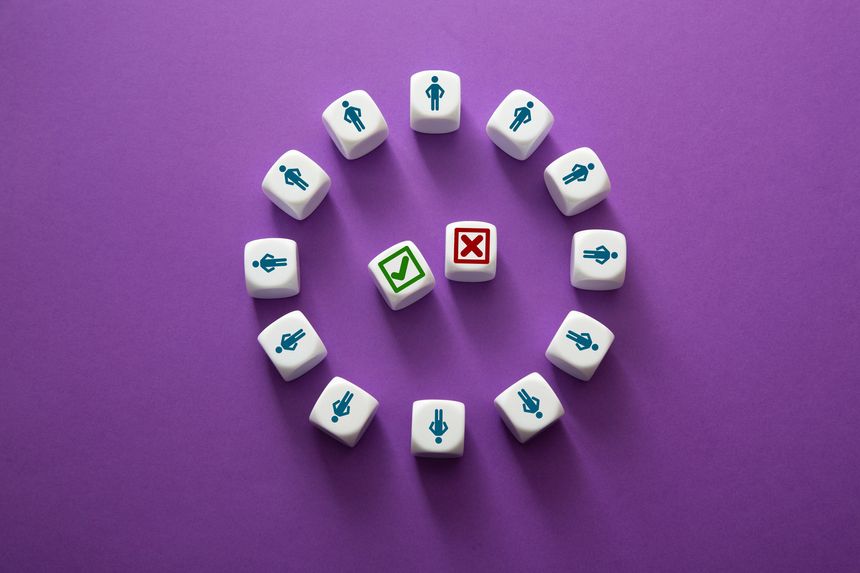 White dice with human icons evaluating business options, making right or wrong decisions