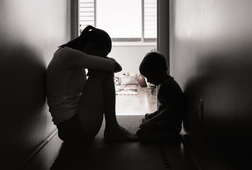 Sad mother and son at home. Quarantine, lockdown.