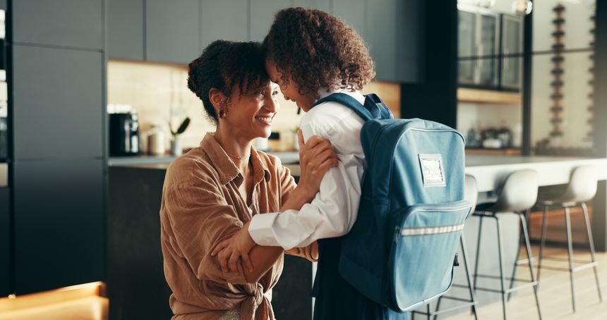 Mom, girl and school uniform with forehead touch in home for preparing or ready for elementary education. Apartment, people and parent with kid for first day with smile, pride and child development