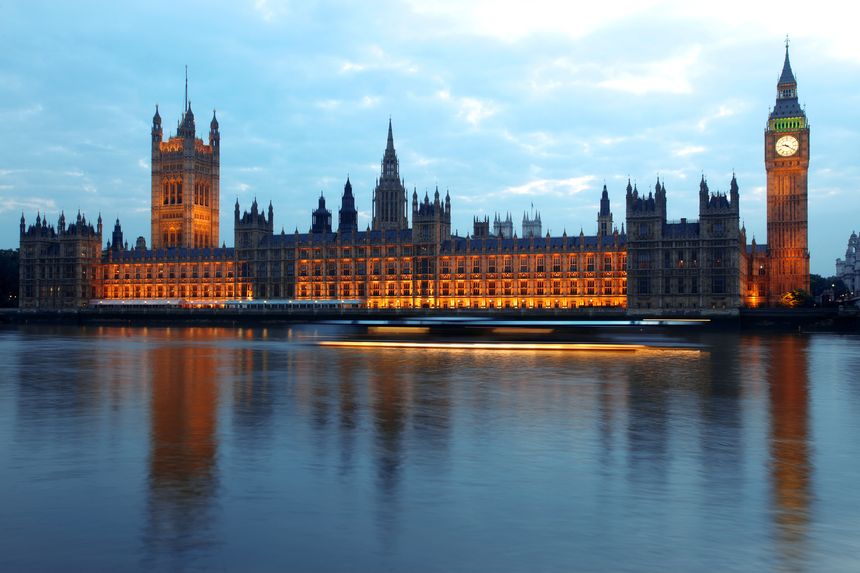 "Evening Big Ben and Houses of Parliamen with moving ship on the Thames, London, UK"