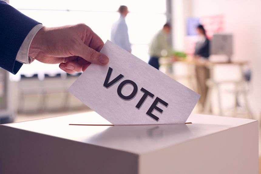 Person Casting Ballot in Election