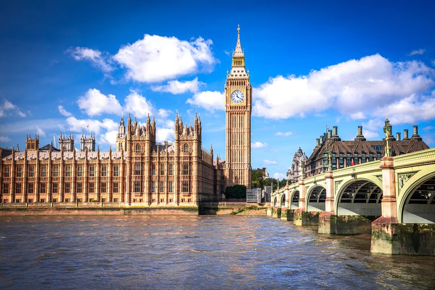 London, United Kingdom. Big Ben and Parliament Building, beautiful blue sky with white clouds.