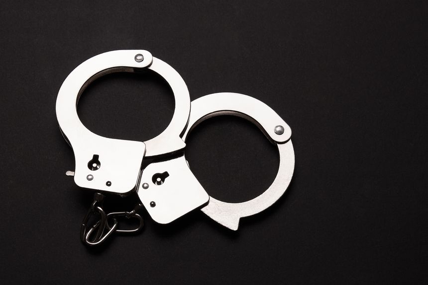 Handcuffs on a black background
