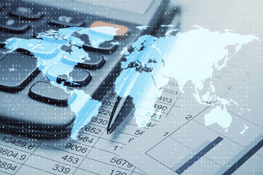 Calculator and pen on financial documents with a world map overlay on a light background. Concept of global business and digital accounting information