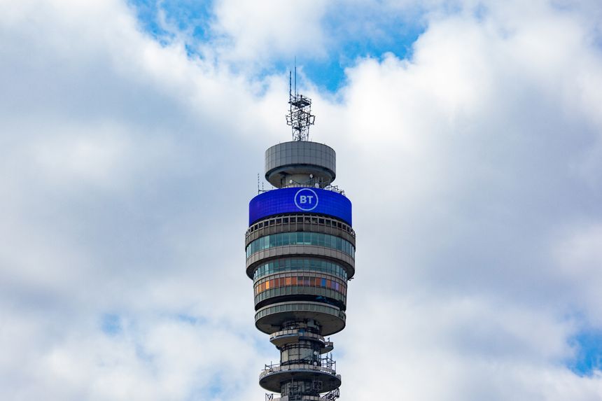 The BT Tower rises against a backdrop of clouds in London. This iconic communication tower is a landmark in the city.