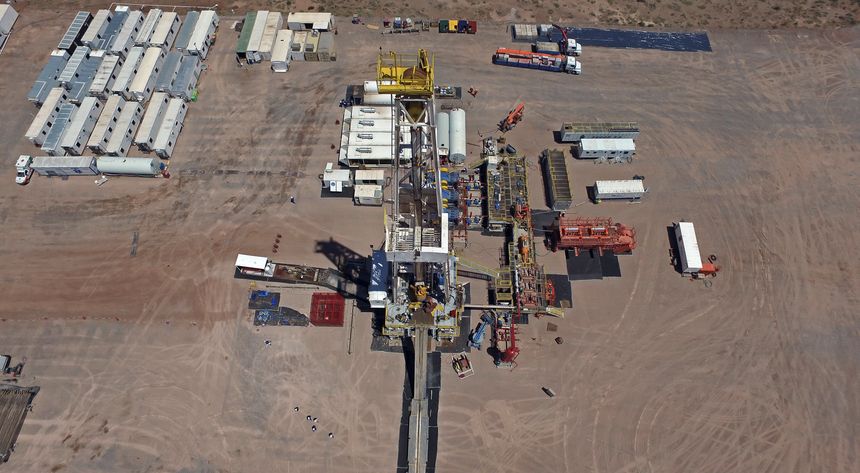 Vaca Muerta, Argentina, January 12, 2016: Extraction of unconventional oil. Battery of pumping trucks for hydraulic fracturing (Fracking).
