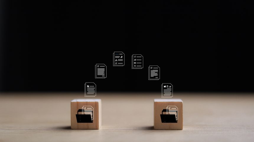 Wooden blocks with virtual document loading to another folder. Data copy or move. Transfer files of data between folders. Exchange of file on folder. Send document to the internet.