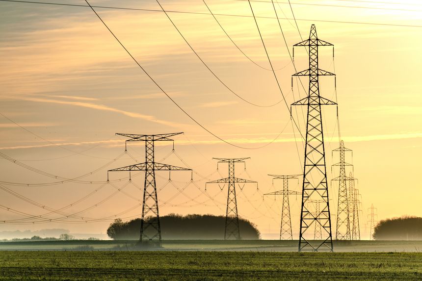 Sunrise with an electricity pylon and nature