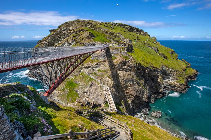Cornwall, UK - June 3rd 2021: A view of the stunning bridge and picturesque scenery at Tintagel Castle in Cornwall, UK.
