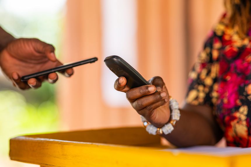 Mobile money (MoMo) in Africa. Digital funds transfer and payments using mobile phones. Fintech, financial inclusion, and cashless transactions.