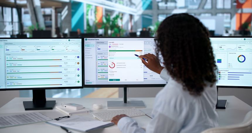 African Woman Insurance Adjuster Uses Software To Review Claims Workflow.