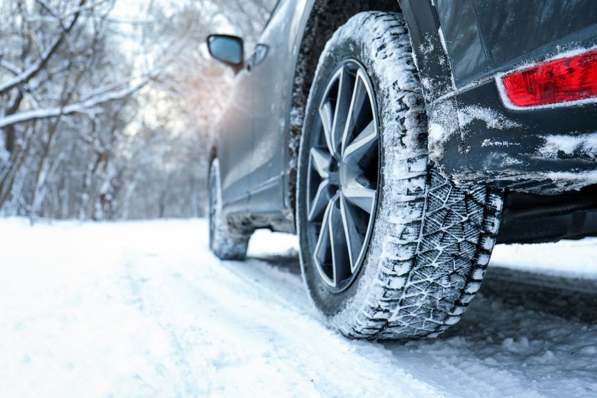 'Winter Car Tire on Snowy Road'