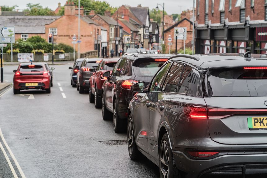 Nantwich, Cheshire, England, September 20th 2025. A row of cars are waiting at a traffic light.