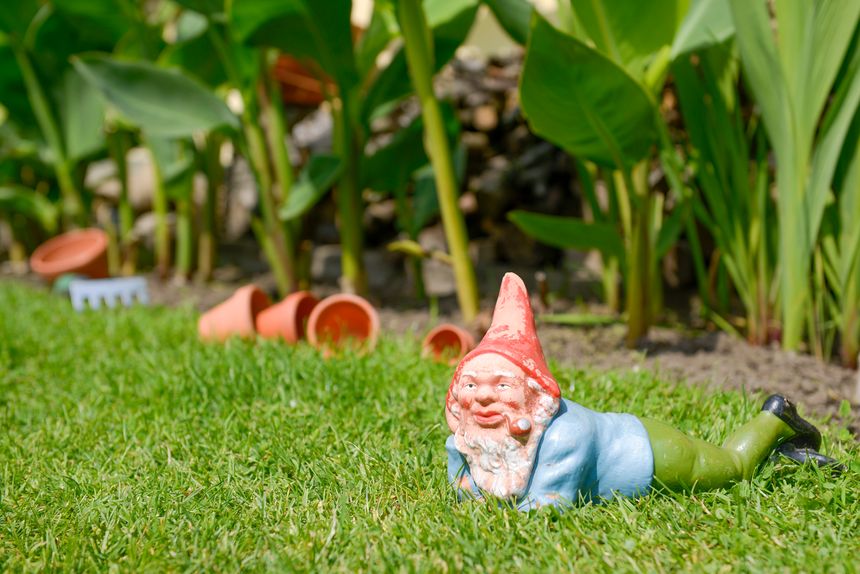 Old garden gnome from clay