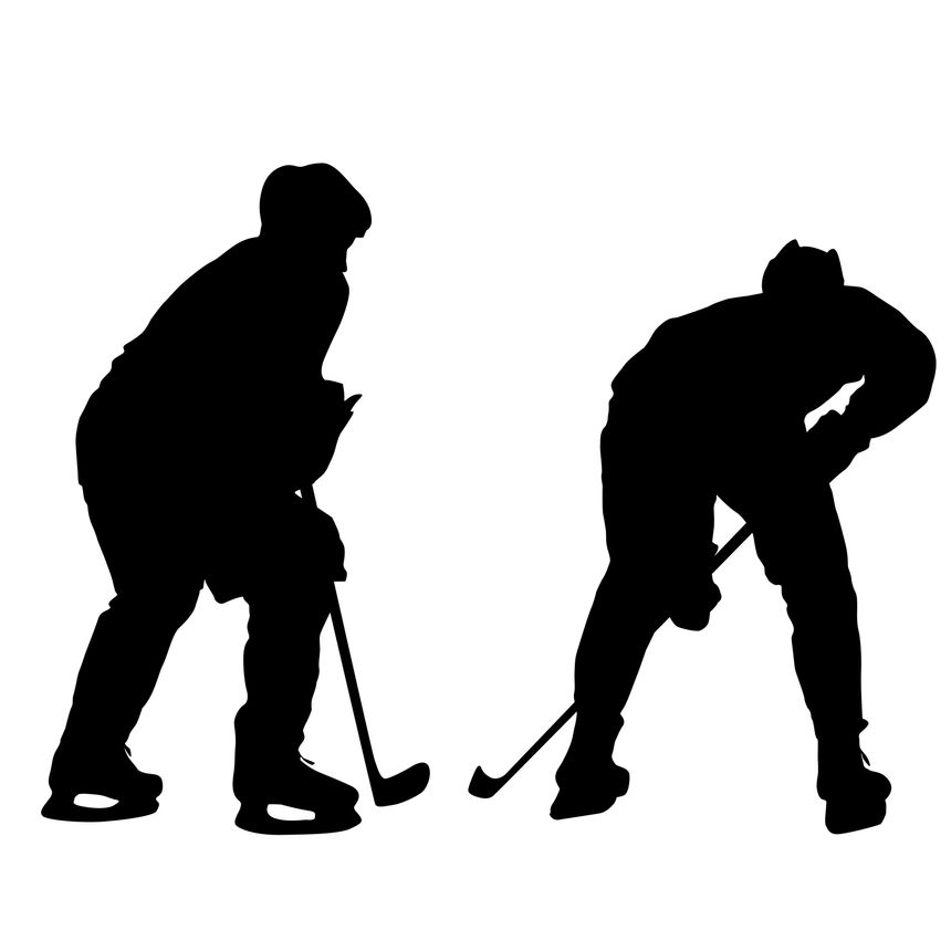 Black silhouettes of two ice hockey players facing each other with sticks isolated on white background. Sports duel concept for graphic design, posters, or team branding.