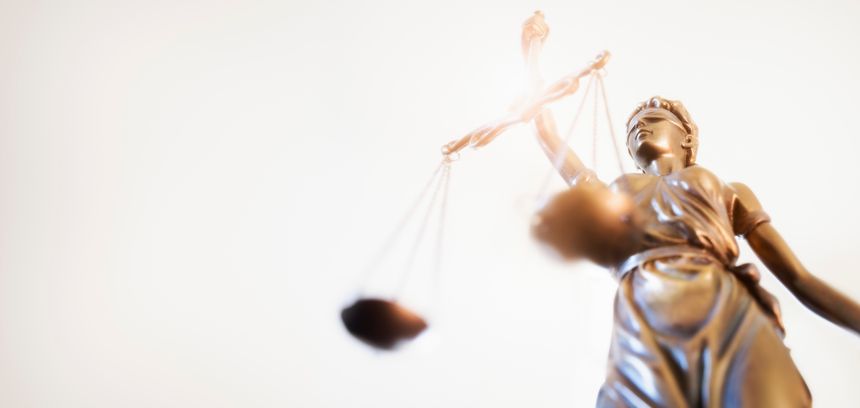 Legal law concept statue of Lady Justice with scales of justice