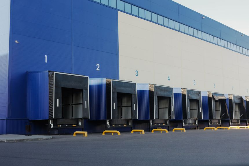 Entrance ramps of the large logistic warehouse with gates for loading goods