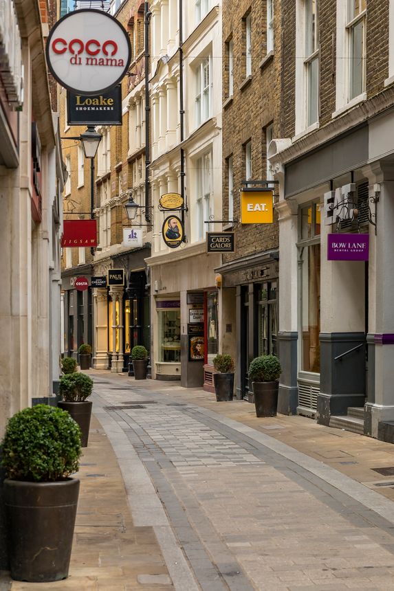 London, England - January 14, 2018: View down quaint empty Bow Lane with restaurants and stores, part of richly historic Bow Lane Conservation Area