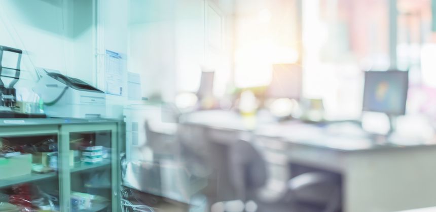 Modern business office without people with blurred bokeh background. tables, chairs, computers, officer building. Business blur in the workplace or work space of table work in office with computer.