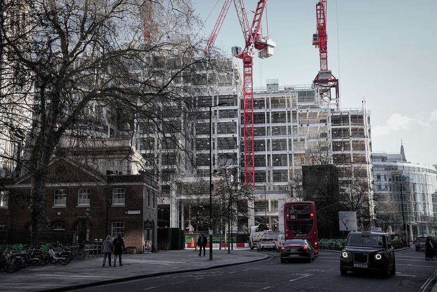 London, England, United Kingdom - February 11, 2024. Redevelopment north of St Paul's Cathedral, Central London daytime street view with pedestrians walking.