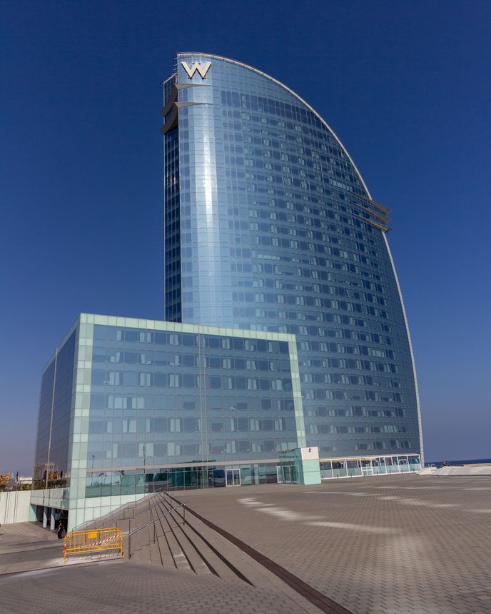 Barcelona, Spain - February 21, 2019 - Exterior of the W Hotel in the Barceloneta district. The building is also known as Hotel Vela (Sail Hotel)
