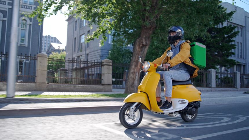 Courier man carry package moped. Guy ride scooter city street deliver box. Green backpack mock up. Fast food delivery service. Person drive bike thermal store bag. Express home order. Rush rider hurry