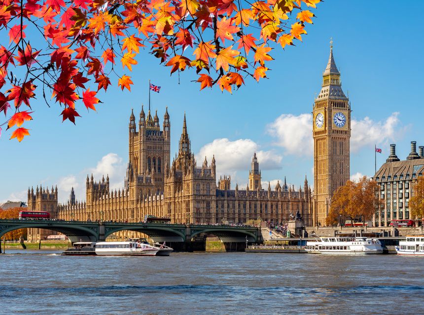 Big Ben tower of Houses of Parliament in autumn, London, UK