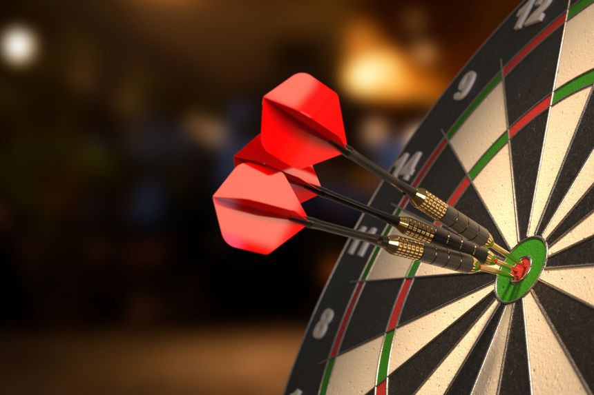 Dartboard with three darts in the bullseyes. 3D illustration