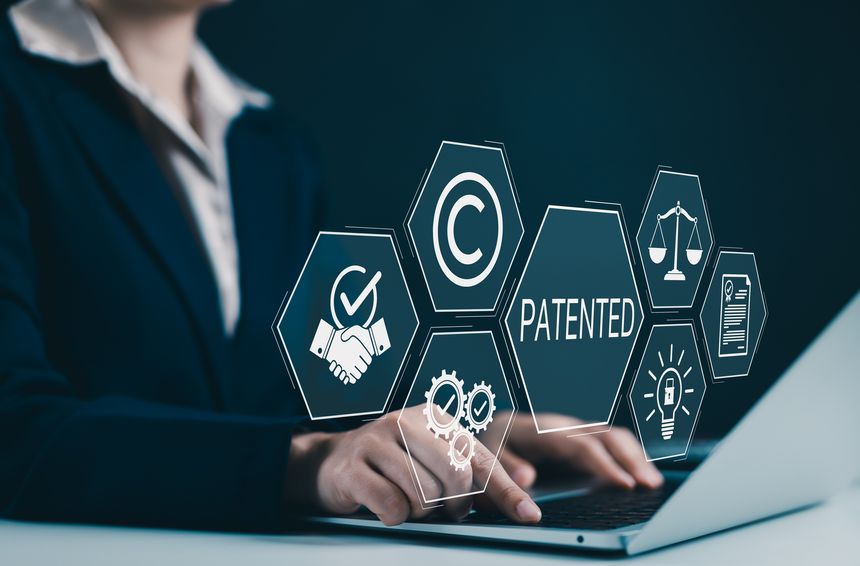 Patent protection and intellectual property rights concept. Businesswoman using laptop with icons related to patent, copyright, legal protection, innovation, registration, and trademark security. TM,