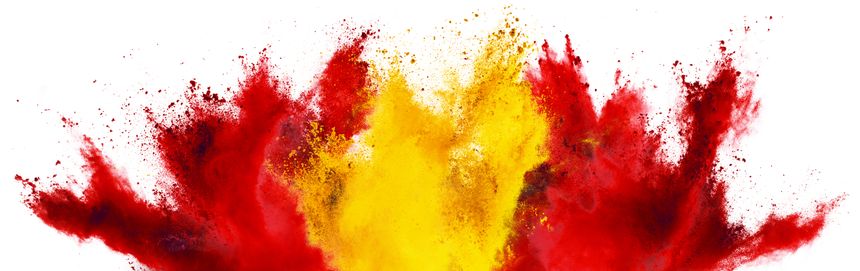 colorful spanish flag red gold yellow color holi paint powder explosion isolated on white background. Spain europe celebration soccer travel tourism concept