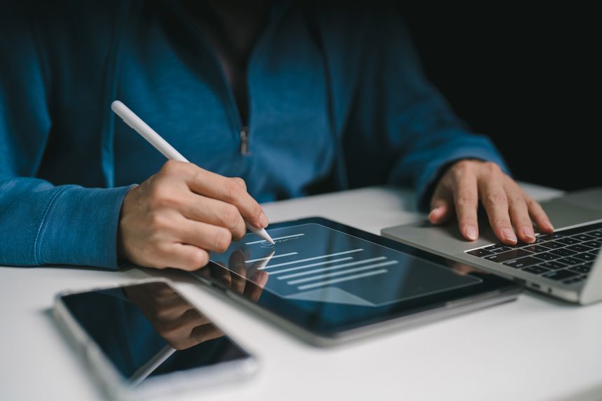 A businesswoman signs a document in the transaction business on a laptop. concept of document electronic, form agreement smart contract agreement bank on technology digital online