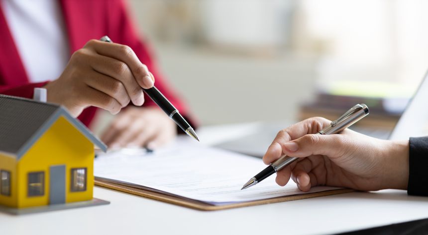 Businesswoman discusses with real estate agent, negotiates and signs contract for purchase of house and land. Wills and inheritance.