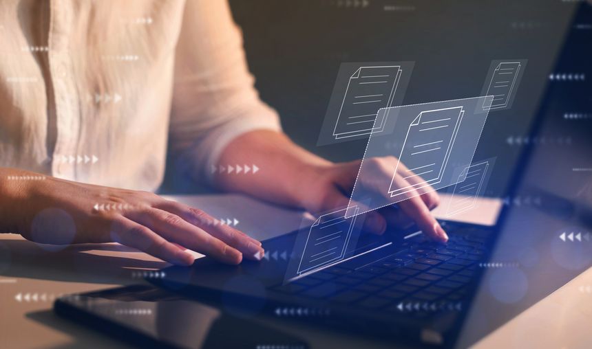 Businesswoman working on laptop with virtual screen. Process automation to efficiently manage files. Online documentation database and document management system concept